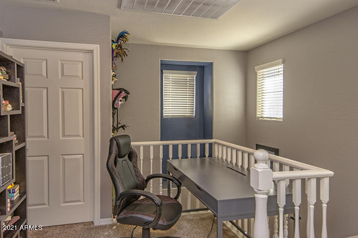1941 West Davis Road Phoenix, AZ 85023 - Photo 11 of 24 a view of a room with furniture window and wooden floor