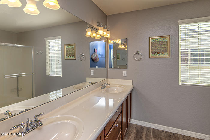 1941 West Davis Road Phoenix, AZ 85023 - Photo 13 of 24 a bathroom with a sink and a mirror
