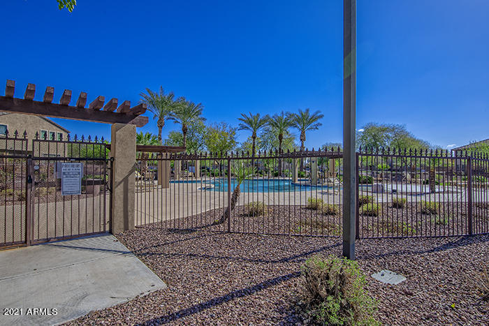 1941 West Davis Road Phoenix, AZ 85023 - Photo 19 of 24 a view of a house with a small yard and a fence