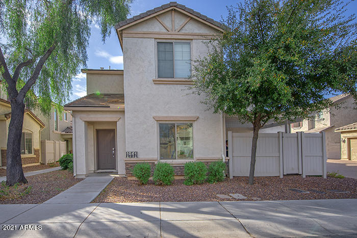 1941 West Davis Road Phoenix, AZ 85023 - Photo 3 of 24 a front view of a house with a yard and garage