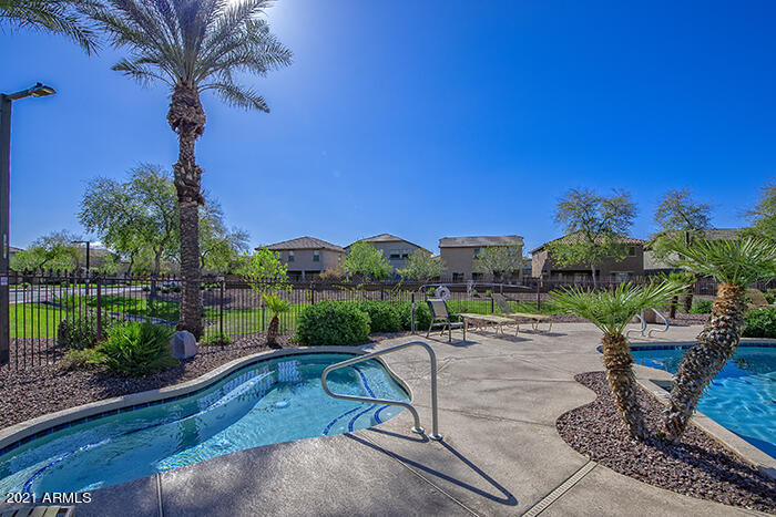 1941 West Davis Road Phoenix, AZ 85023 - Photo 4 of 24 a view of a patio with a table and chairs under an umbrella