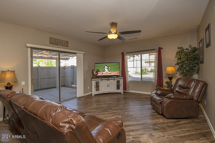 1941 West Davis Road Phoenix, AZ 85023 - Photo 8 of 24 a living room with furniture and a fireplace