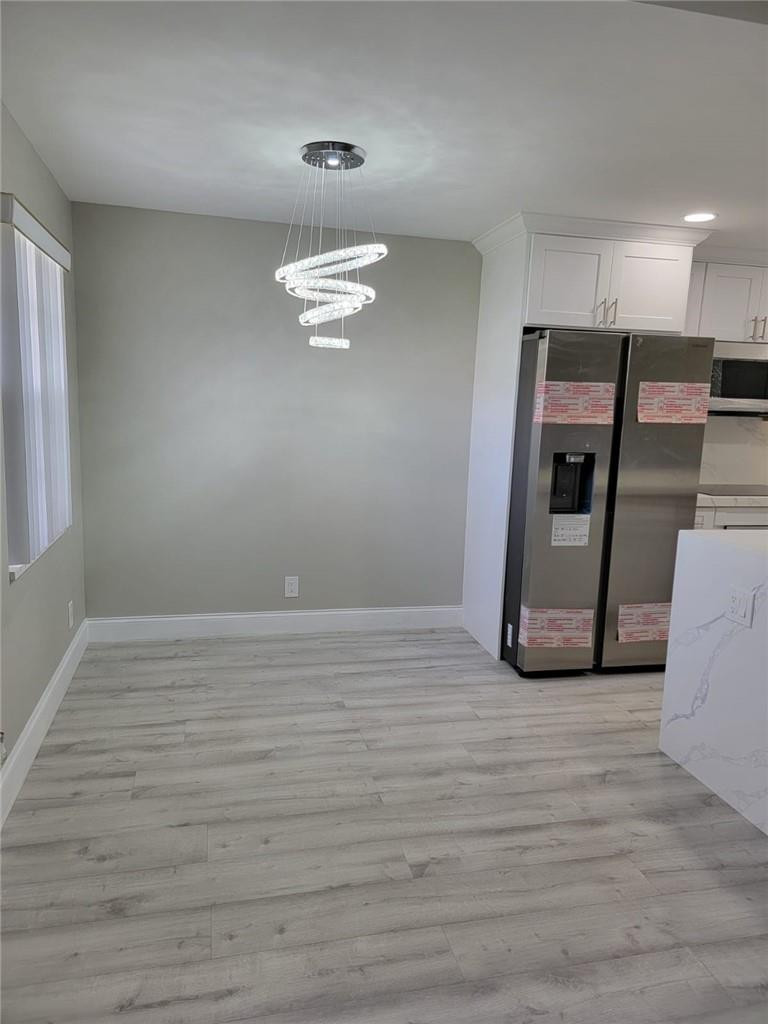 296 Brighton H, Unit H Boca Raton, FL 33434 - Photo 2 of 11 a view of an empty room with a window
