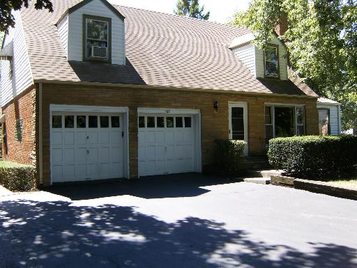 1672 Harding Road Northfield, IL 60093 - Photo 1 of 15 a front view of a house with a yard
