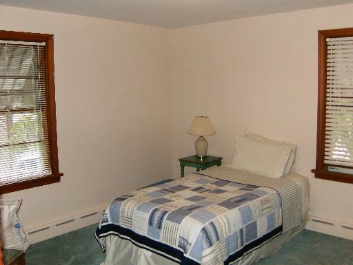 1672 Harding Road Northfield, IL 60093 - Photo 8 of 15 a bedroom with a bed and window