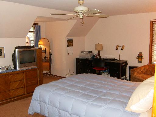 1672 Harding Road Northfield, IL 60093 - Photo 9 of 15 a bedroom with a bed and a chandelier