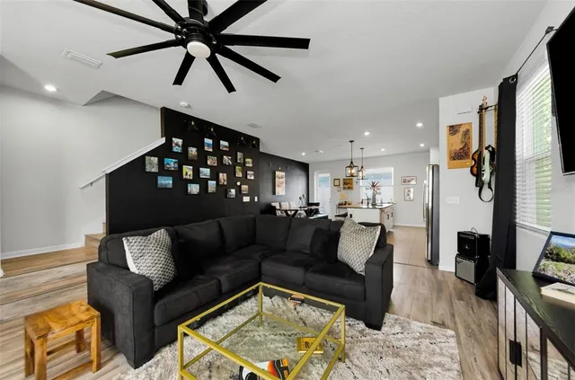 a reading room with furniture and wooden floor