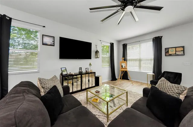 a large kitchen with a table and chairs in it