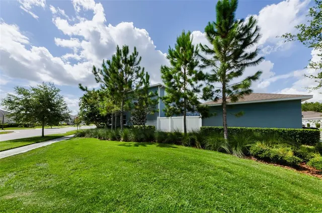 a view of a livingroom with wooden floor and a window