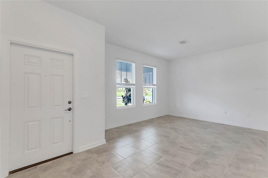 1721 Good Neighbor Loop Kissimmee, FL 34744 - Photo 12 of 28 a view of an empty room with a window