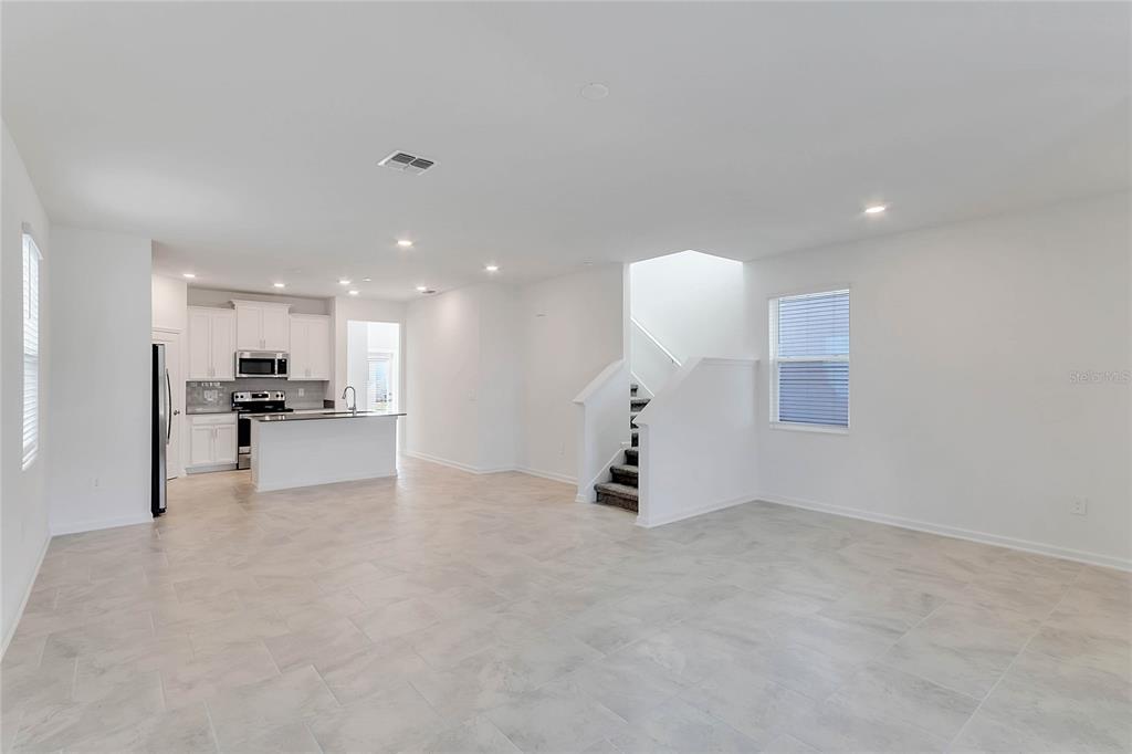 1721 Good Neighbor Loop Kissimmee, FL 34744 - Photo 13 of 28 a view of an empty room and kitchen view