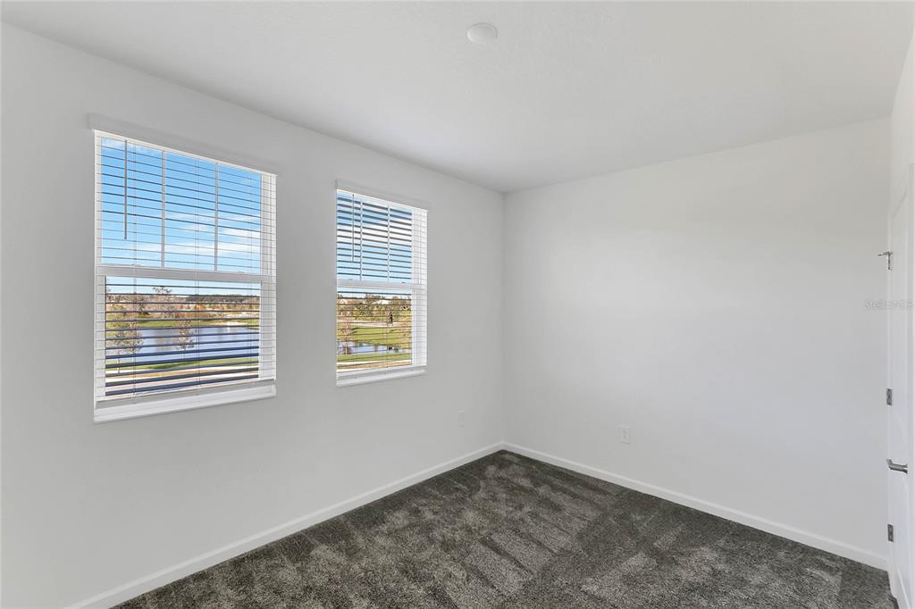 1721 Good Neighbor Loop Kissimmee, FL 34744 - Photo 14 of 28 a view of an empty room with a window