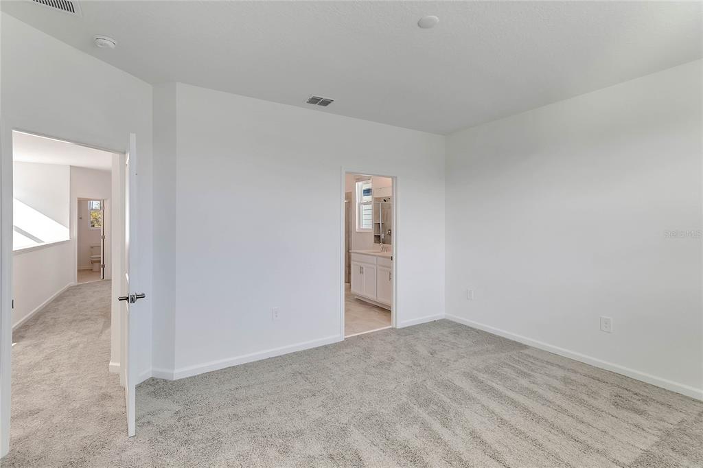 1721 Good Neighbor Loop Kissimmee, FL 34744 - Photo 21 of 28 wooden floor in an empty room