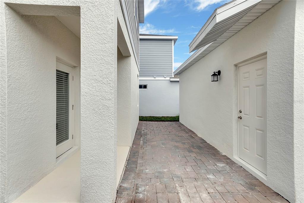 1721 Good Neighbor Loop Kissimmee, FL 34744 - Photo 24 of 28 a view of a hallway with white walls
