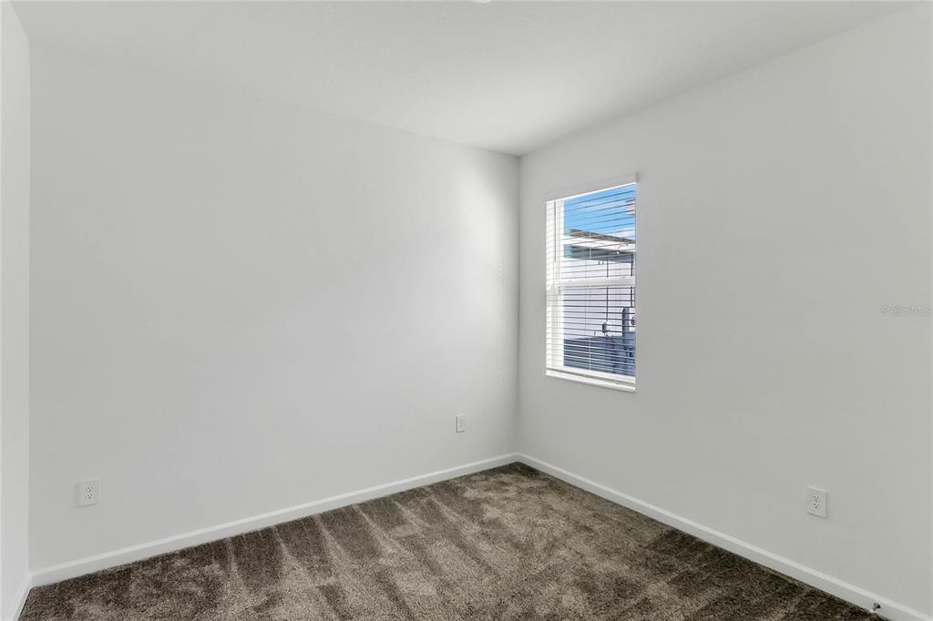 1721 Good Neighbor Loop Kissimmee, FL 34744 - Photo 10 of 28 a view of an empty room with a window