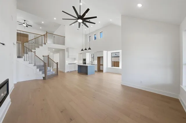 a view of livingroom with hardwood floor and a ceiling fan