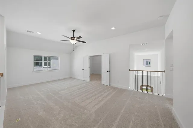 a view of a livingroom with a ceiling fan