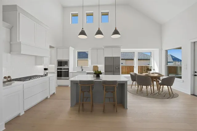 a dining room with furniture a rug and wooden floor