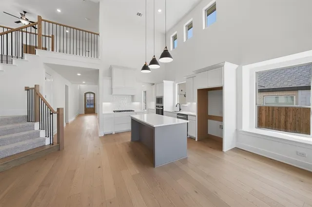 a kitchen with cabinets and window