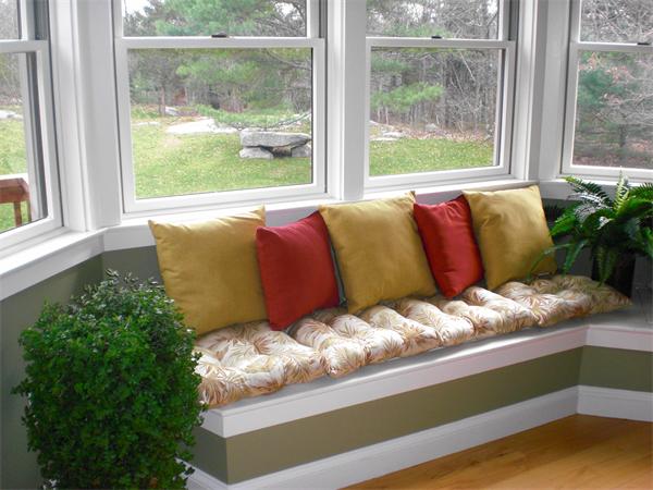 9 Bray Street Gloucester, MA 01930 - Photo 4 of 19 a bed sitting in a bedroom next to a window