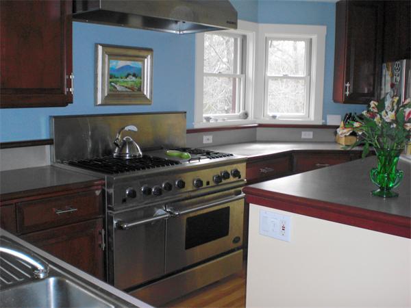 9 Bray Street Gloucester, MA 01930 - Photo 8 of 19 a stove top oven sitting inside of a kitchen
