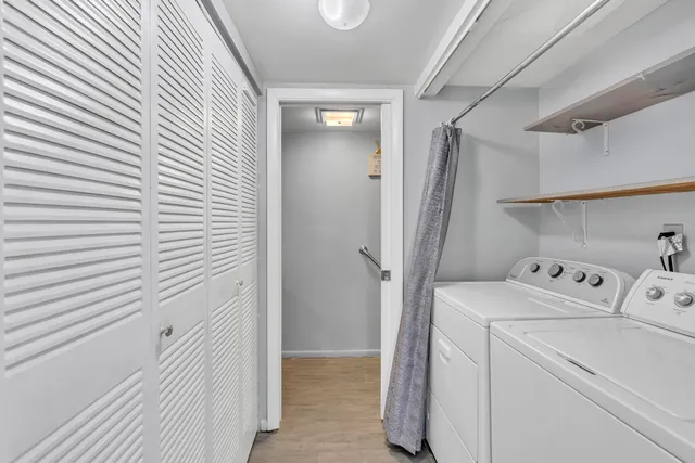 a view of storage and utility room with washer and dryer