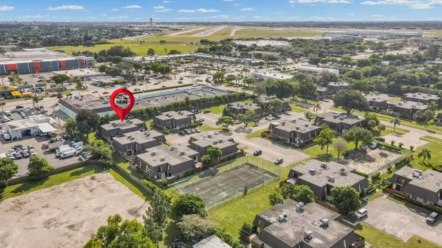 an aerial view of residential houses with outdoor space