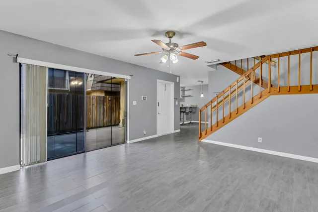 a view of an entryway with wooden floor