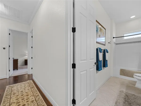 a spacious bathroom with a tub a double vanity sink and a mirror