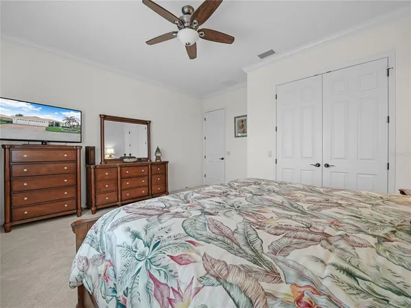 a spacious bathroom with a double vanity sink a mirror and a shower