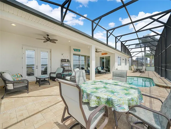 a view of a livingroom with furniture and a bookshelf