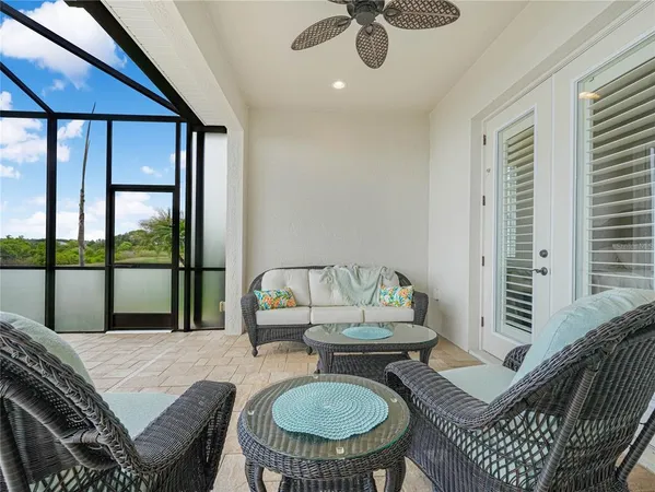 a large room with lots of white furniture