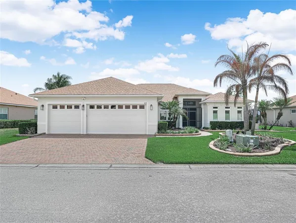 a kitchen with stainless steel appliances granite countertop a sink a stove and a wooden cabinets