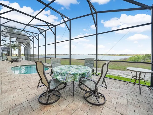 a kitchen with stainless steel appliances kitchen island granite countertop a sink stove and refrigerator