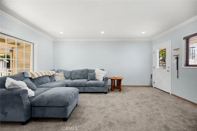 a living room with furniture and windows