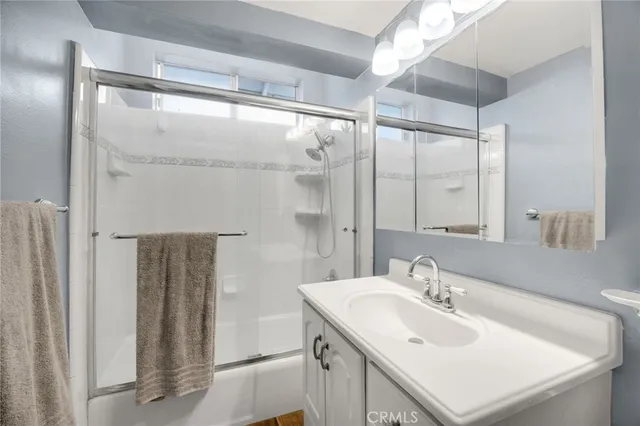 a bathroom with a sink double vanity and a mirror
