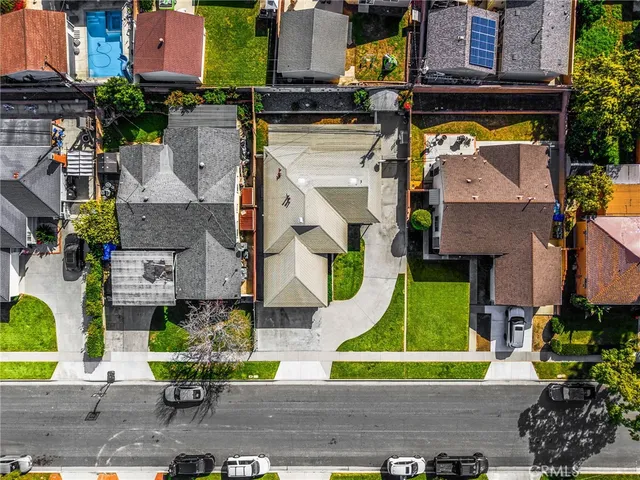 an aerial view of houses with outdoor space