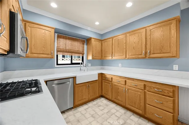 a kitchen with sink cabinets and window