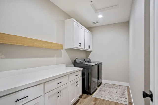 a kitchen with stainless steel appliances a sink and cabinets