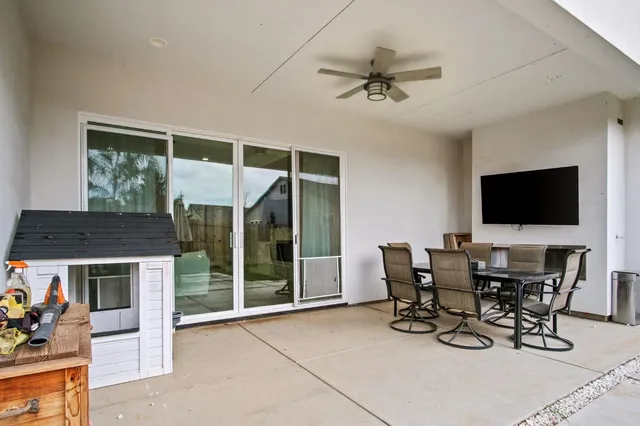 a view of a livingroom with furniture and a flat screen tv