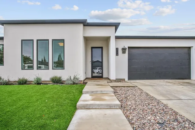 front view of a house with a yard