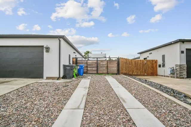a view of a backyard of the house