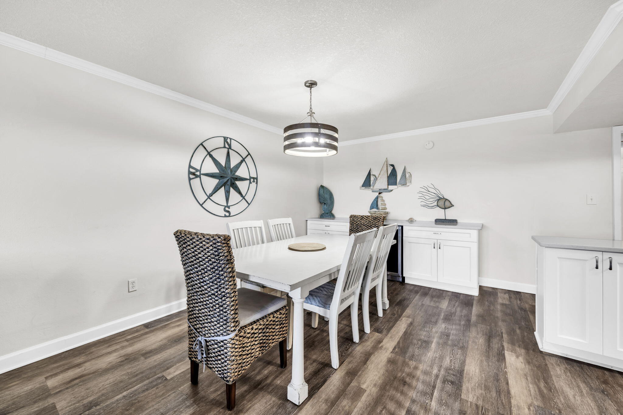 676 Santa Rosa Boulevard, Unit 1F Fort Walton Beach, FL 32548 - Photo 12 of 36 a view of a dining room with furniture window and wooden floor