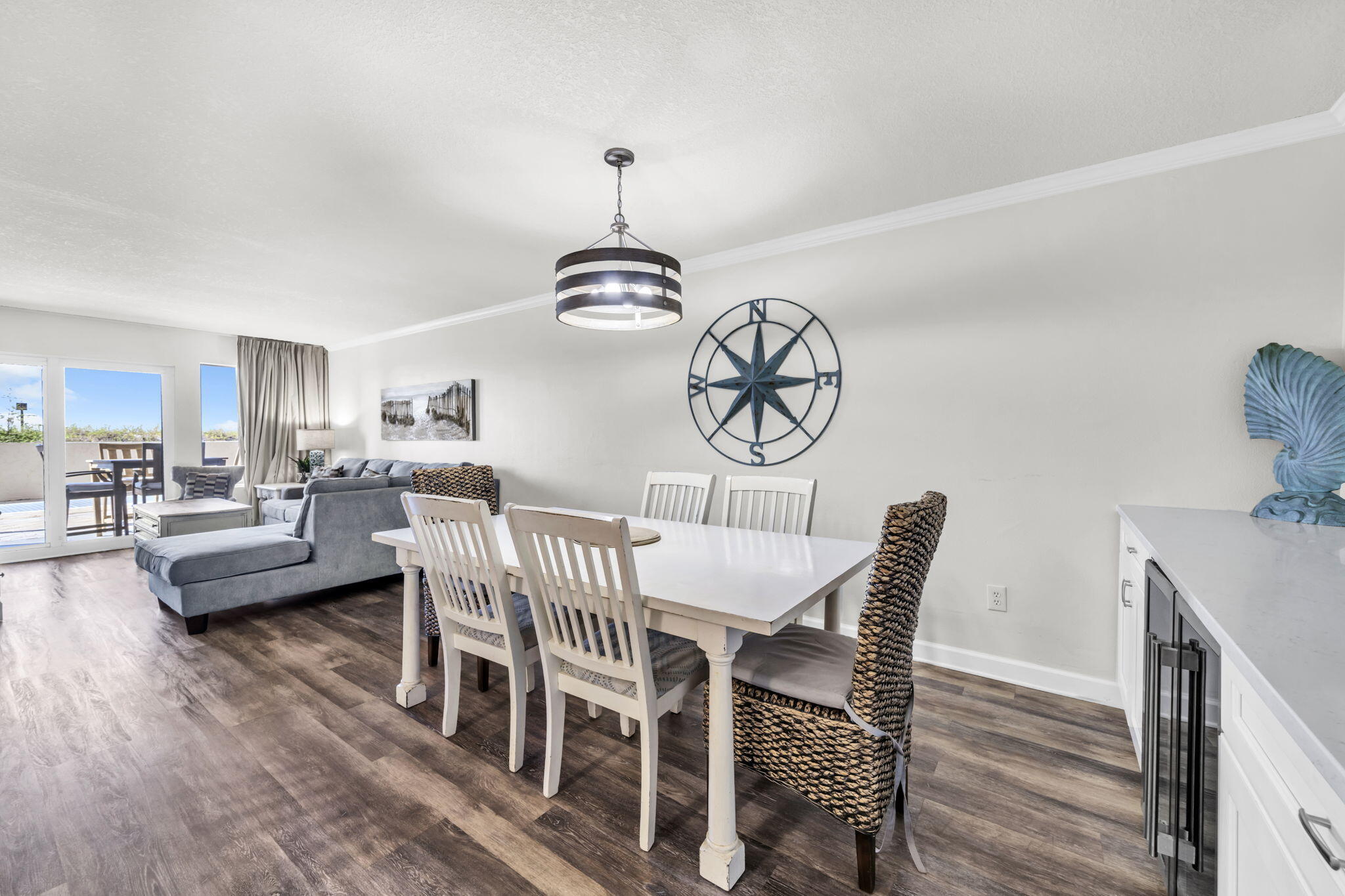 676 Santa Rosa Boulevard, Unit 1F Fort Walton Beach, FL 32548 - Photo 13 of 36 a view of a dining room with furniture window and wooden floor