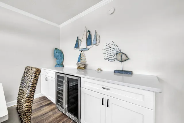a large kitchen with a table and chairs