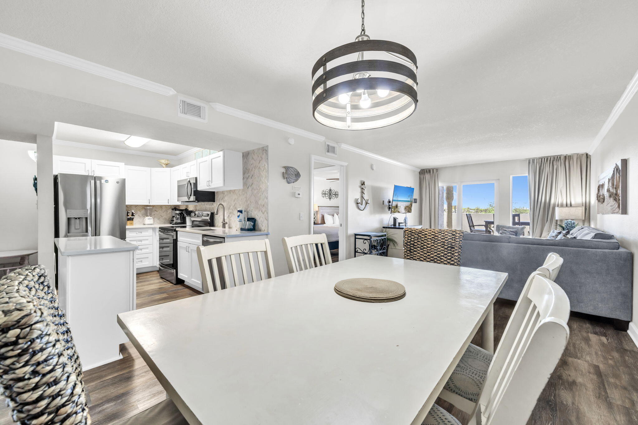 676 Santa Rosa Boulevard, Unit 1F Fort Walton Beach, FL 32548 - Photo 15 of 36 a large kitchen with a table and chairs