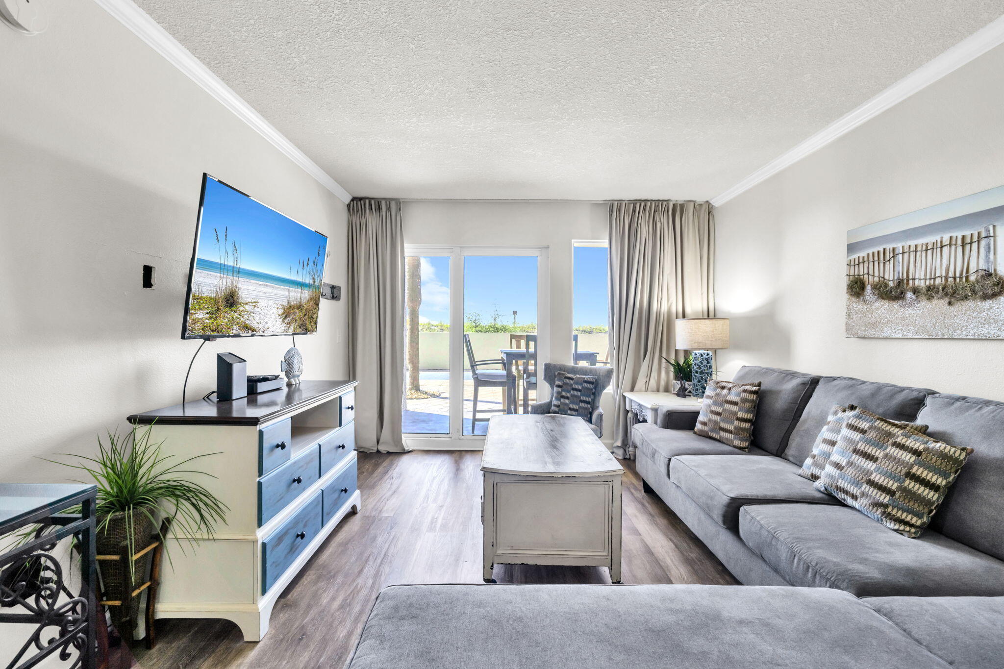 676 Santa Rosa Boulevard, Unit 1F Fort Walton Beach, FL 32548 - Photo 17 of 36 a living room with furniture potted plant and a window