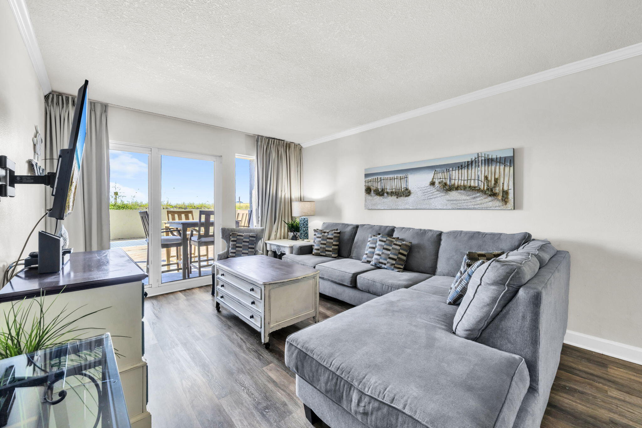 676 Santa Rosa Boulevard, Unit 1F Fort Walton Beach, FL 32548 - Photo 18 of 36 a living room with furniture wooden floor and a large window