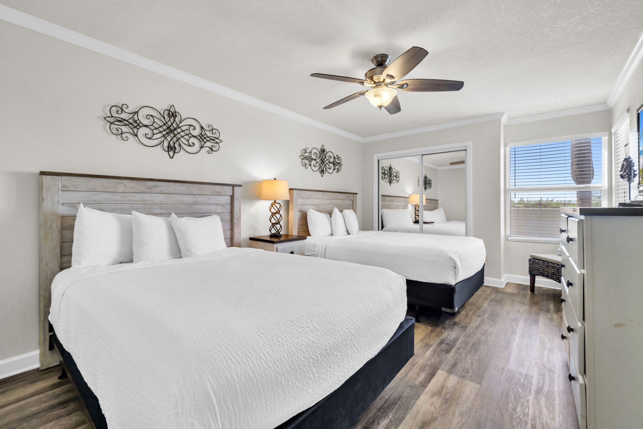 676 Santa Rosa Boulevard, Unit 1F Fort Walton Beach, FL 32548 - Photo 22 of 36 a bedroom with a large bed and a chandelier