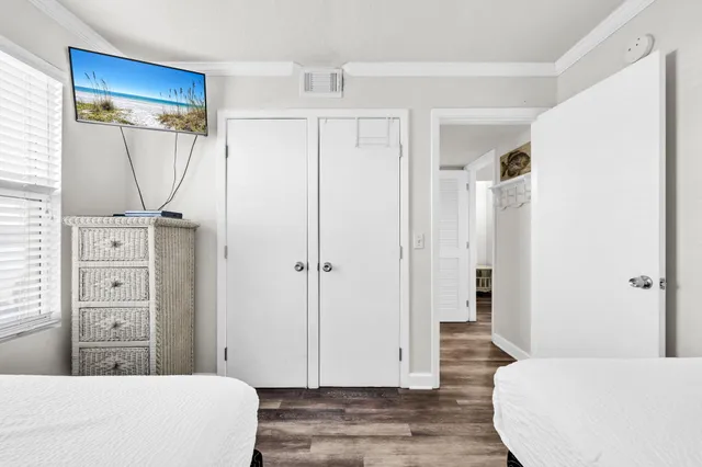 a bedroom with a bed and a mirror